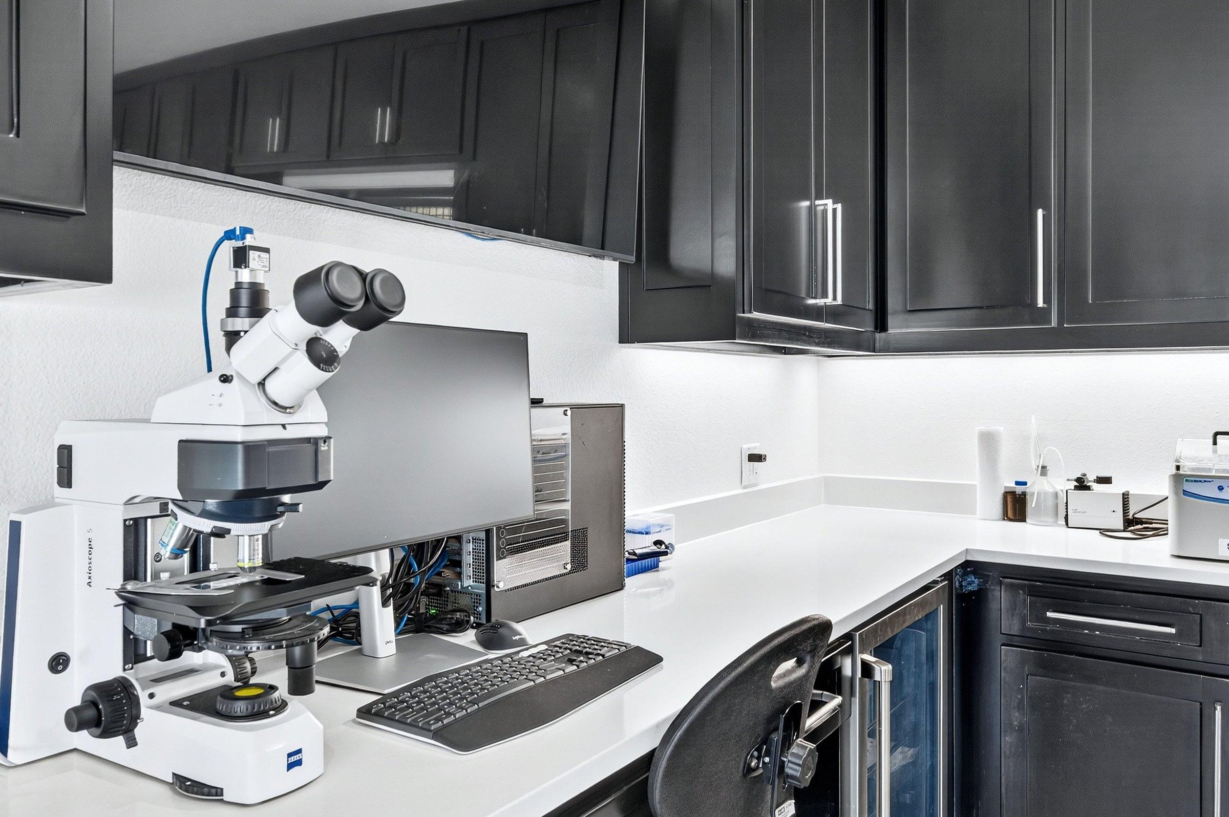 A microscope and monitor station in the Solo Select Diagnostics lab