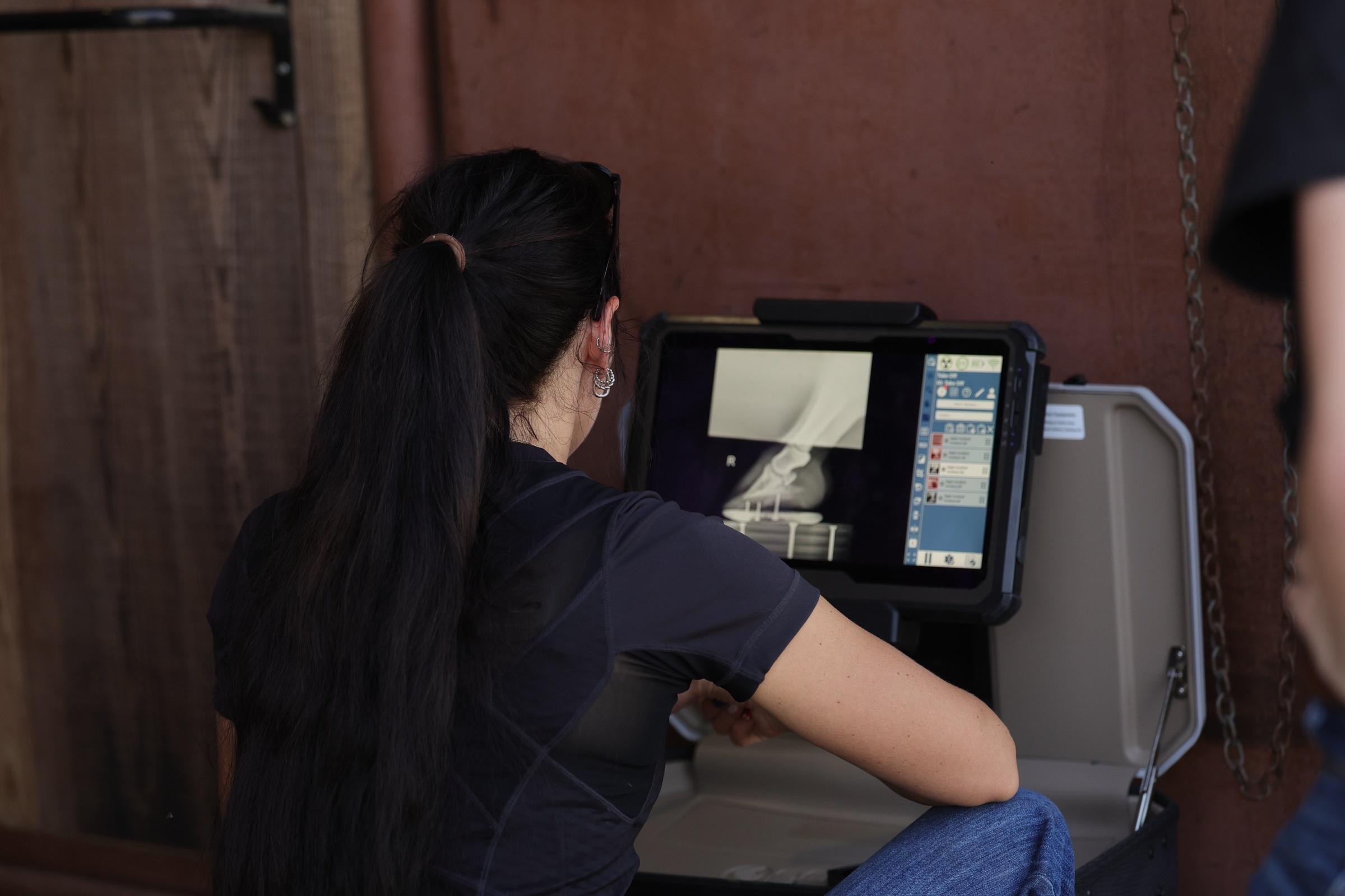 Solo Select veterinary staff reviewing a digital radiograph on site