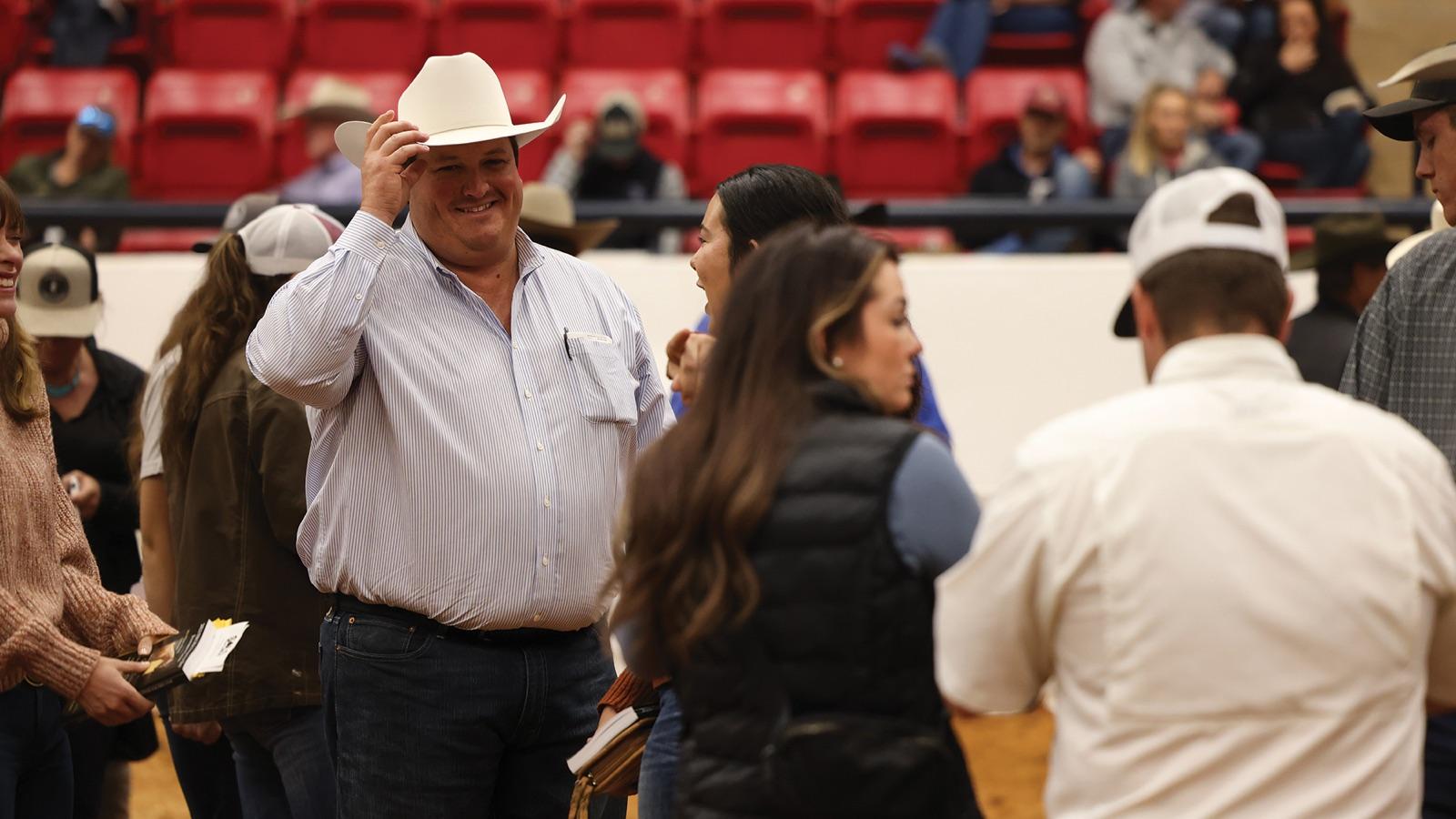 Ty Smith, CEO of Solo Select Horses, tipping his hat at a horse sale