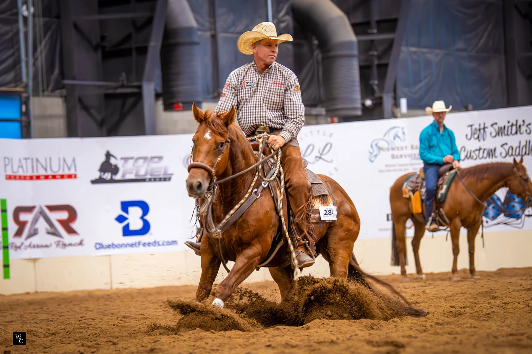 Chestnut gelding Hey Ol Son working in a reined cow horse arena