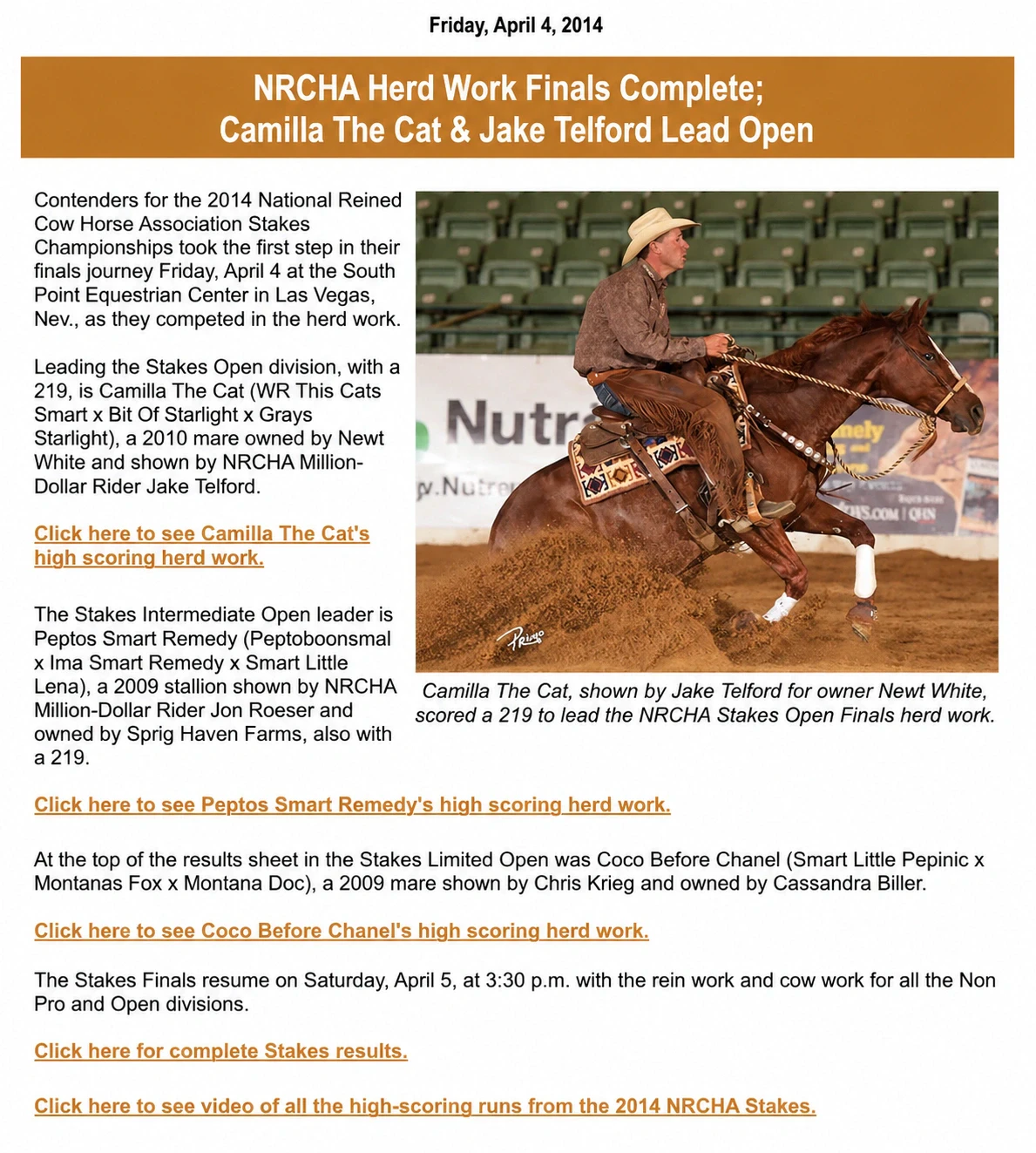 A rider in a tan cowboy hat and chaps performs a hard stop on a sorrel horse in an indoor arena, kicking up dirt.